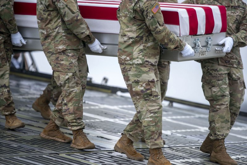 A U.S. Army carry team carries the transfer case containing the remains of Army Sgt. Breonna Moffett during a dignified transfer at Dover Air Force Base in Dover, Del., on February 2, 2024. Moffett was one of three American soldiers killed in Jordan in January in a drone strike attributed to Iranian-backed militant groups. File Photo by Bonnie Cash/UPI
