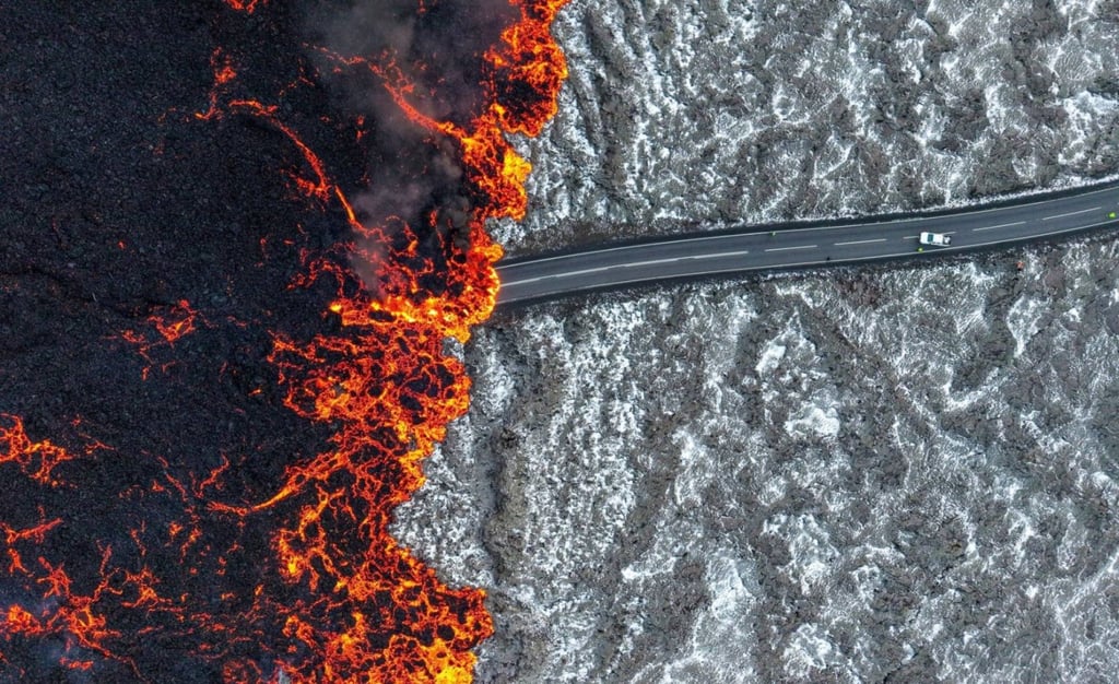 Lava flows on to a road near the town of Grindavík. Photo: EPA-EFE Lava flows on to a road near the town of Grindavík. Photo: EPA-EFE