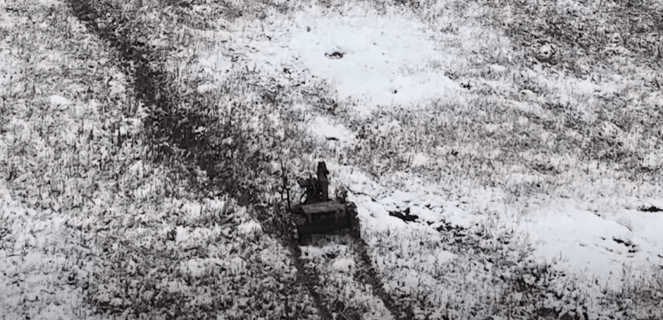 The robots leave tracks in the snow as they advance