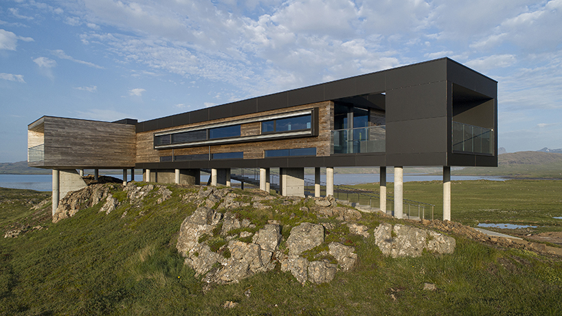 gudmundur jonsson's casa G rests on columns along mountainous icelandic landscape