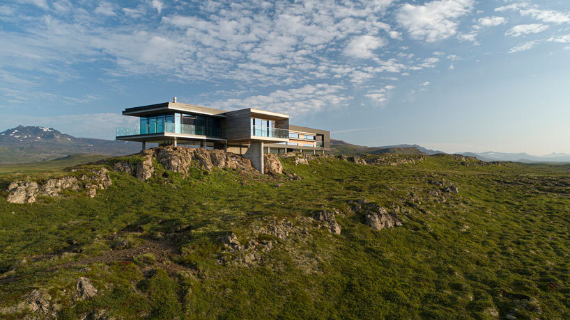 gudmundur jonsson's casa G rests on columns along mountainous icelandic landscape