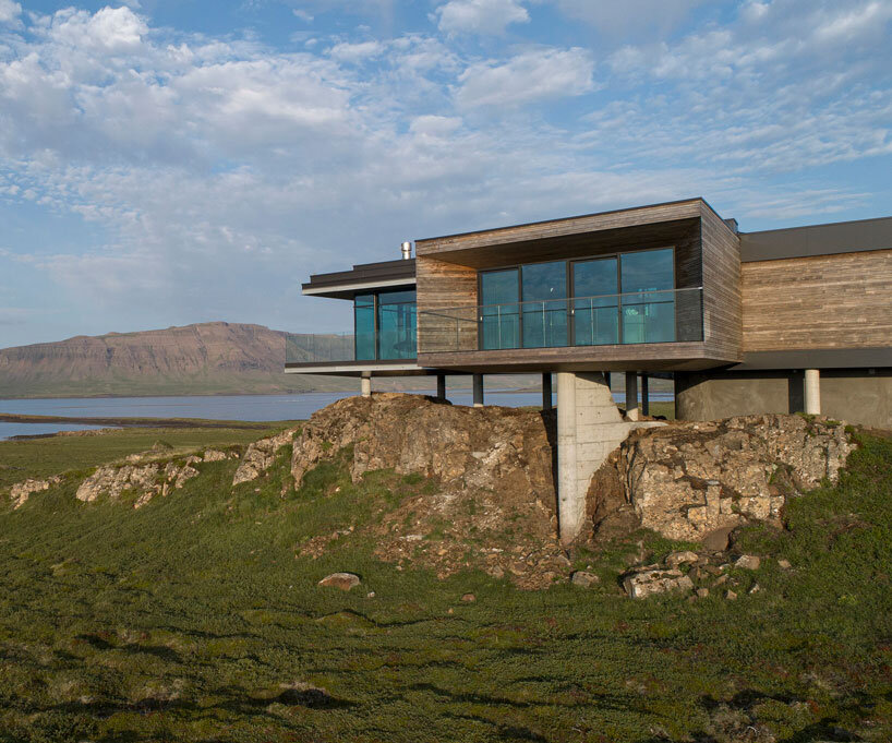 gudmundur jonsson's casa G rests on columns along mountainous icelandic landscape