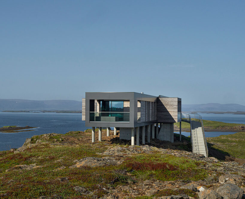 gudmundur jonsson's casa G rests on columns along mountainous icelandic landscape