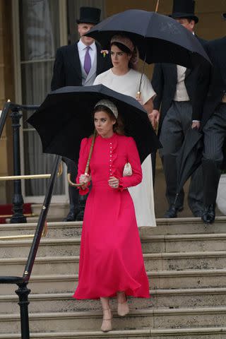 Yui Mok-WPA Pool/Getty Princess Beatrice (front) and Princess Eugenie arrive for the Sovereign's Garden Party at Buckingham Palace on May 21, 2024 in London, England