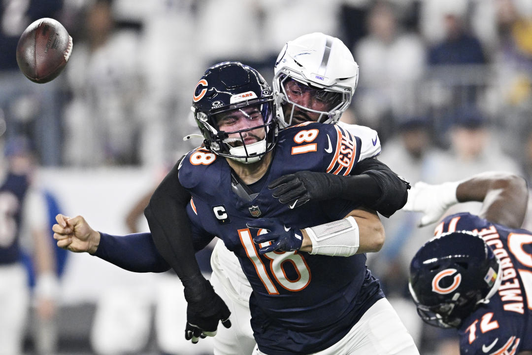 MINNEAPOLIS, MINNESOTA - DECEMBER 16: Jonathan Greenard #58 of the Minnesota Vikings strips sacks Caleb Williams #18 of the Chicago Bears during the first quarter at U.S. Bank Stadium on December 16, 2024 in Minneapolis, Minnesota. Minnesota recovered the ball on the play. (Photo by Stephen Maturen/Getty Images)