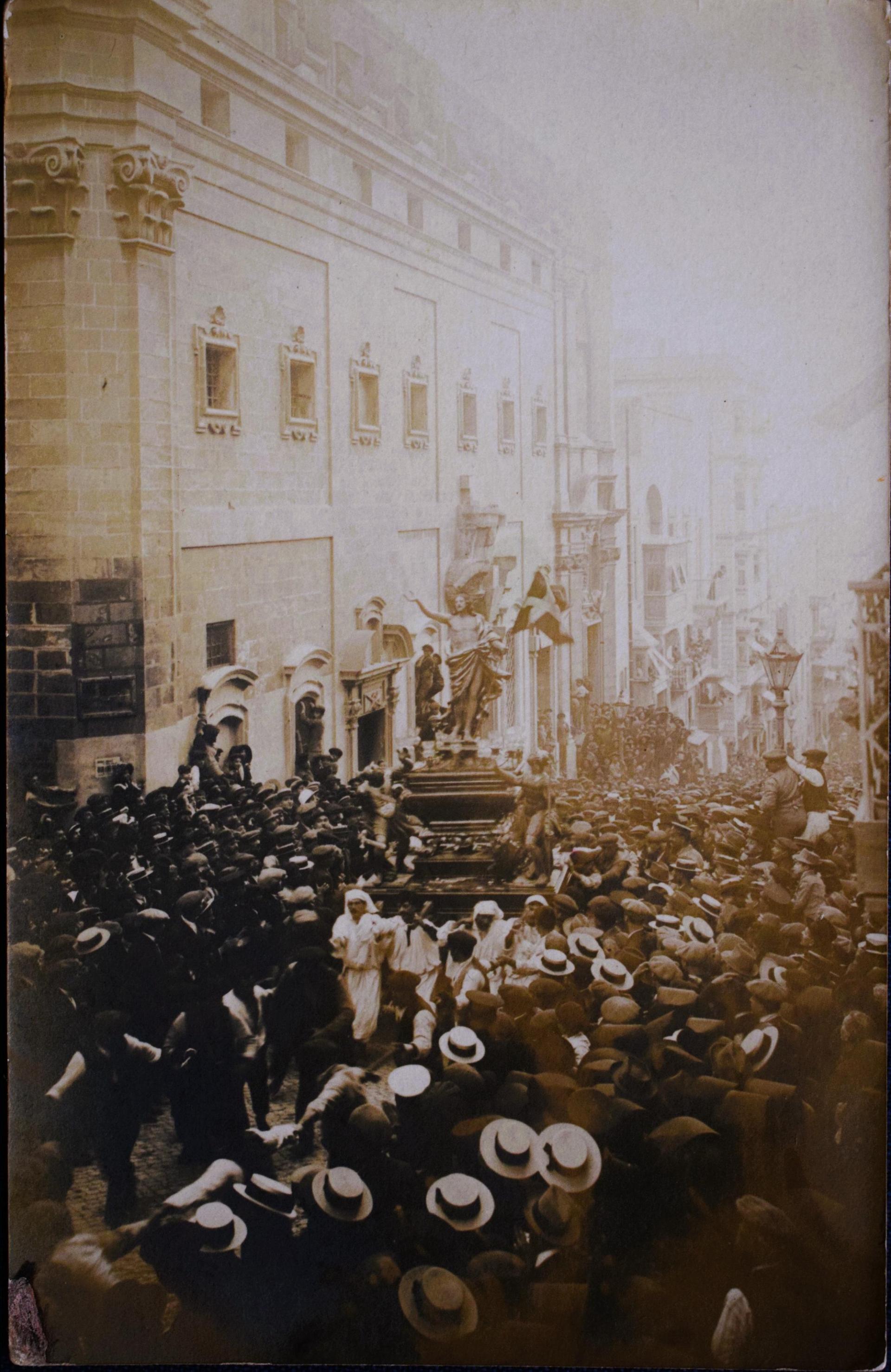 The Easter 'Rxoxt' procession speeding uphill in Valletta, early 1920s.
