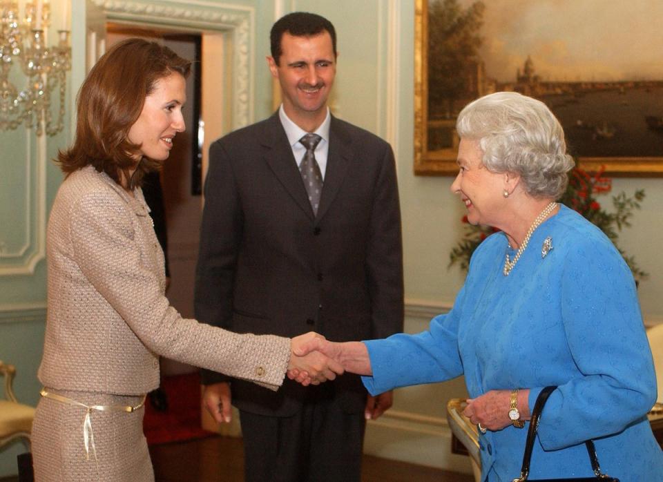 Bashar and Asma Assad meeting the late Queen (PA)