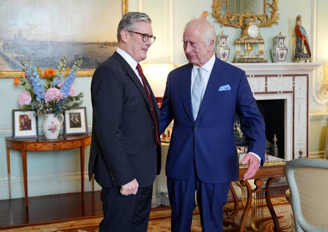 The King speaks to Sir Keir Starmer during an audience at Buckingham Palace, where he invited the leader of the Labour Party to become Prime Minister