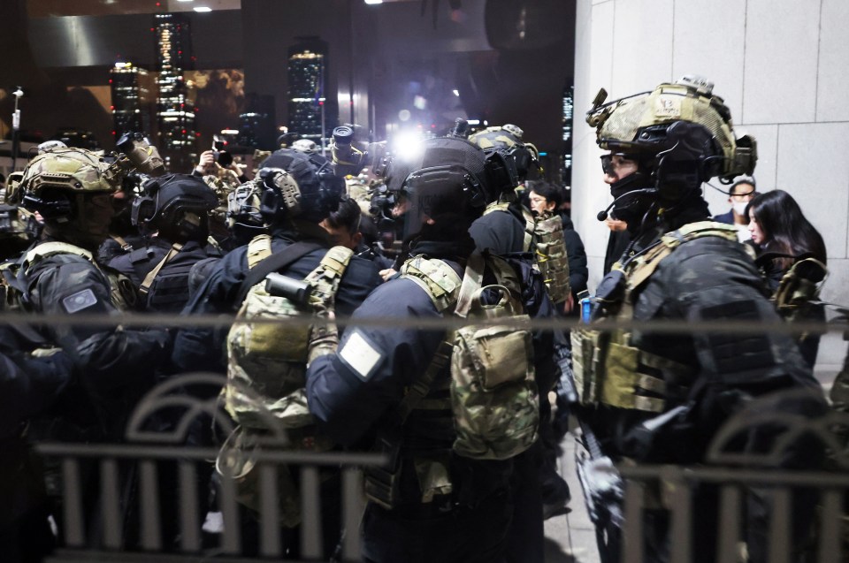 Soldiers prepare to enter the main hall of the National Assembly in Seoul following President Yoon Suk Yeol’s declaration of martial law