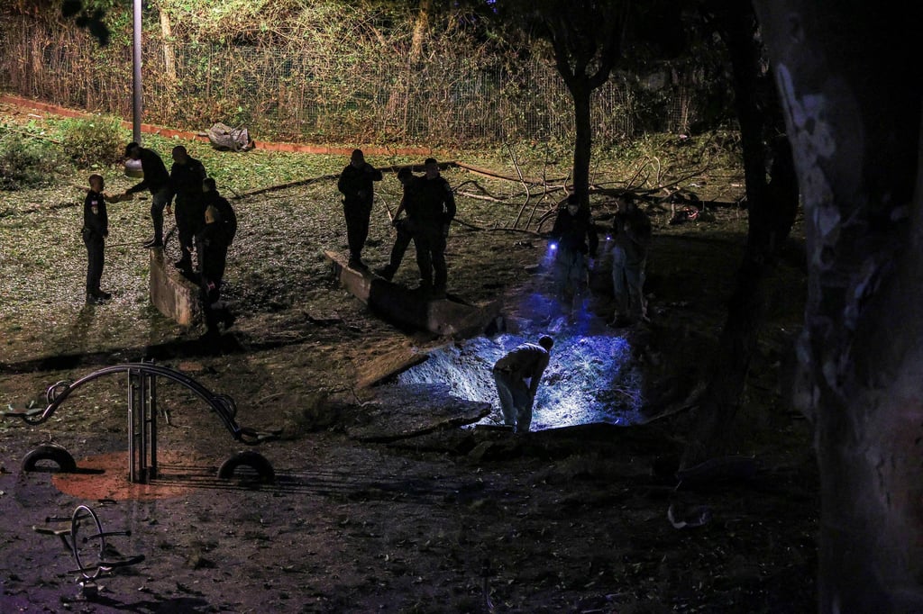 Israeli emergency services work at the scene of a missile strike that, according to Israel’s military, was launched from Yemen and landed in Jaffa, south of Tel Aviv. Photo: Reuters