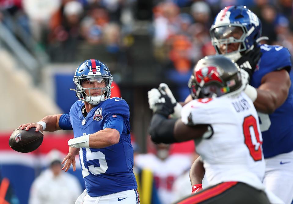 EAST RUTHERFORD, NEW JERSEY - NOVEMBER 24: Tommy DeVito #15 of the New York Giants throws a pass against the Tampa Bay Buccaneers during the first half at MetLife Stadium on November 24, 2024 in East Rutherford, New Jersey. (Photo by Dustin Satloff/Getty Images)