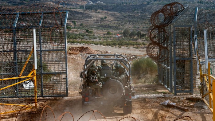 An Israeli military vehicle crosses into the buffer zone with Syria in the Israel-occupied Golan Heights on Tuesday
