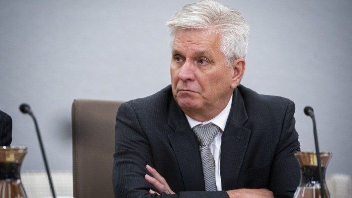 Christopher Waller listens at an event