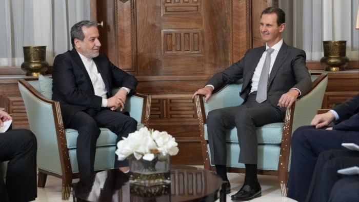 Iranian Foreign Minister Abbas Araghchi and Syrian President Bashar al-Assad