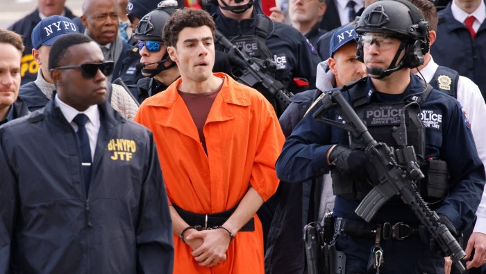 Luigi Mangione arrives at a helicopter pad in New York after being extradited from Pennsylvania