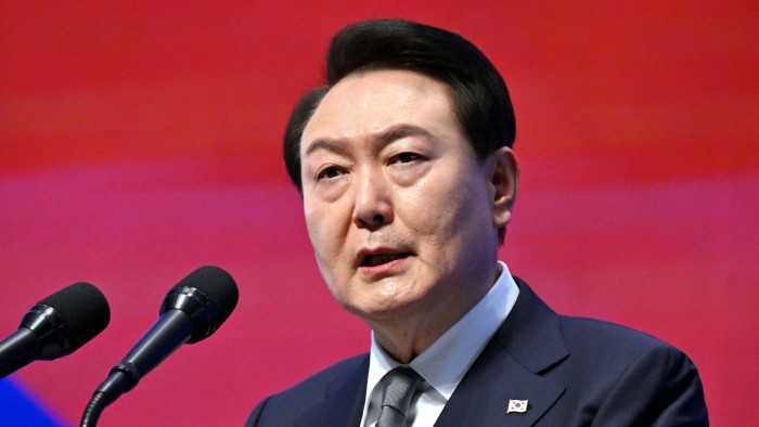 Yoon Suk Yeol speaks at a podium during a ceremony