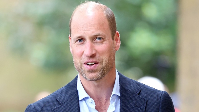 Prince William smiles for the camera