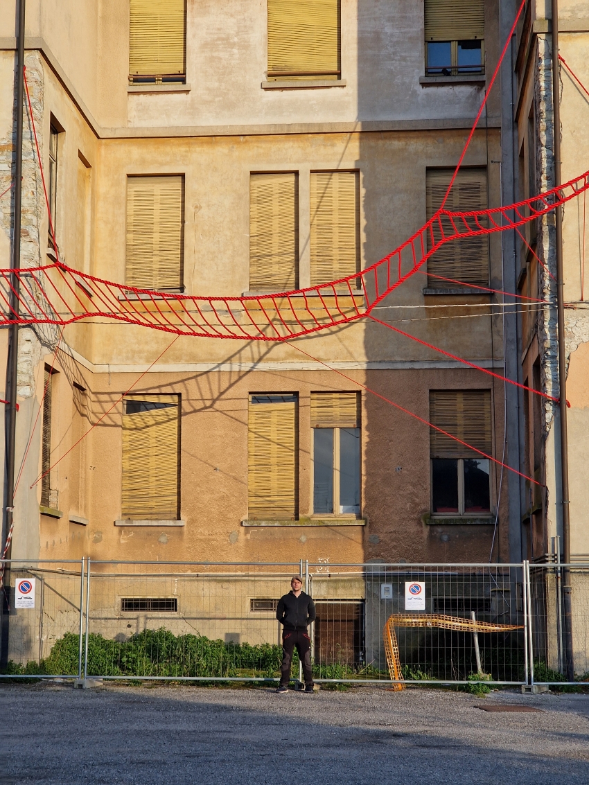 la cura threaded installation by ECO weaves across neglected elementary school in italy