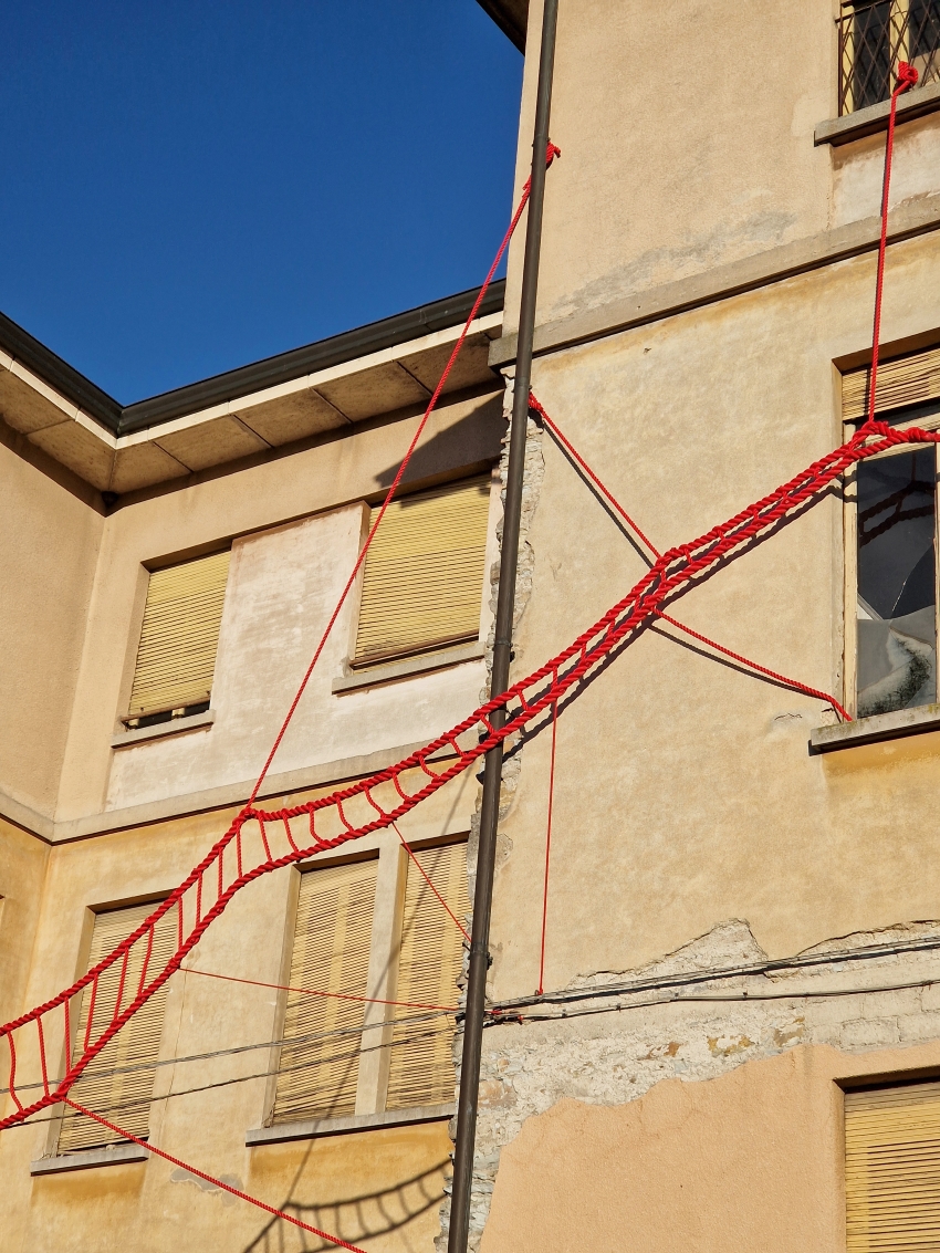 la cura threaded installation by ECO weaves across neglected elementary school in italy