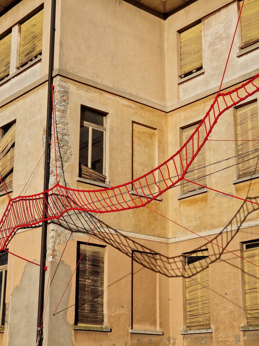 la cura threaded installation by ECO weaves across neglected elementary school in italy