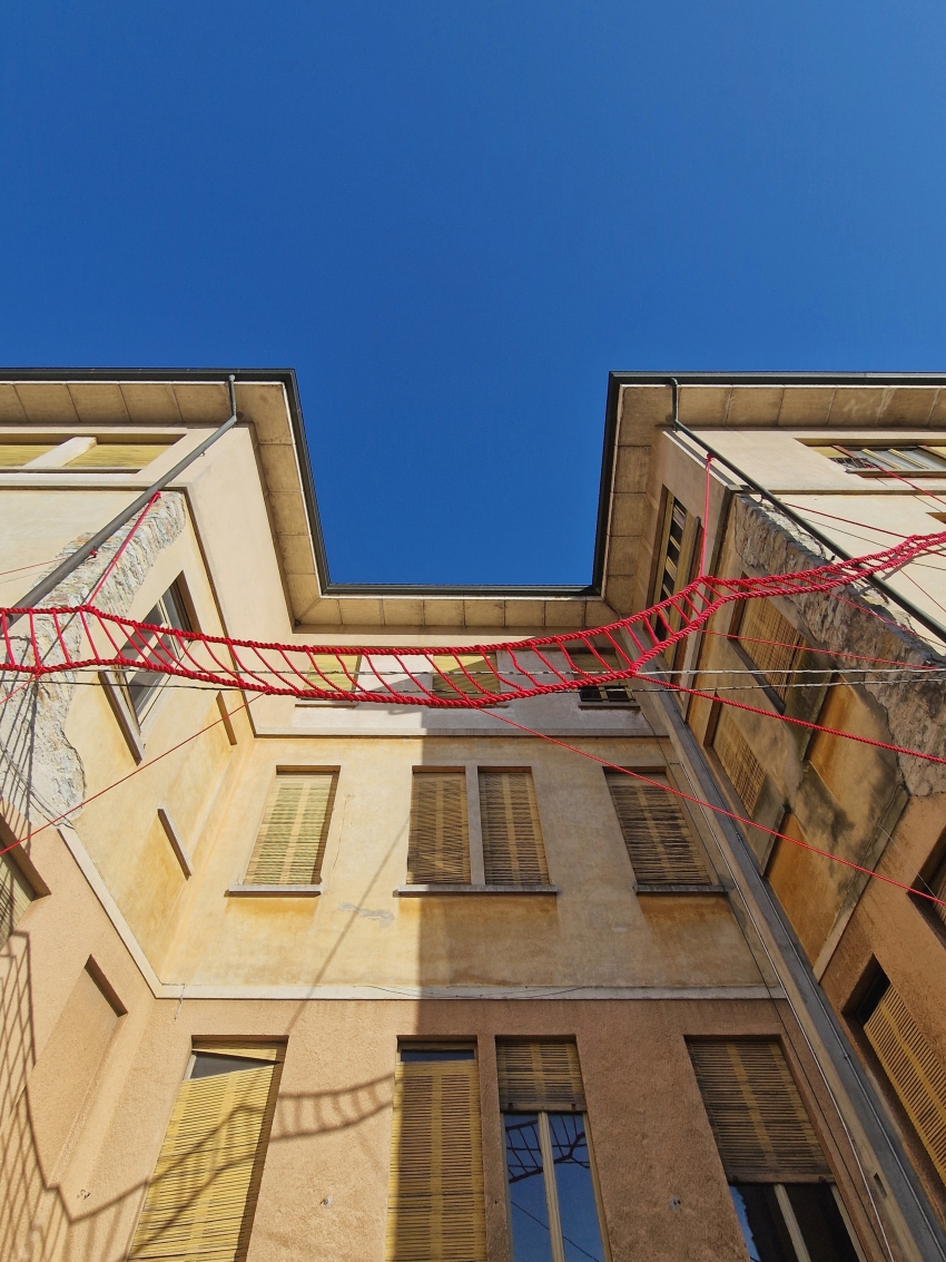 la cura threaded installation by ECO weaves across neglected elementary school in italy