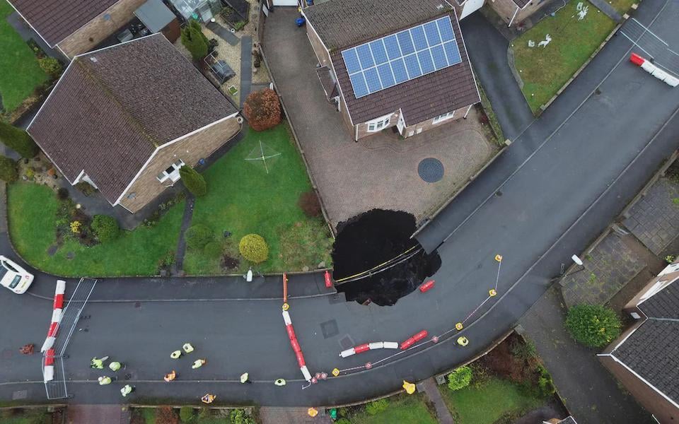 50ft sinkhole opens up in pavement