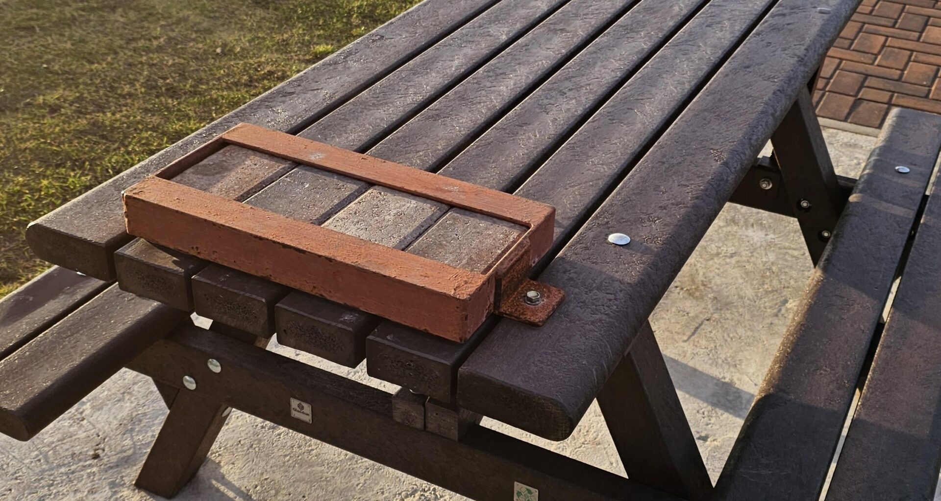 Picknick tables with bricks attached in Leven