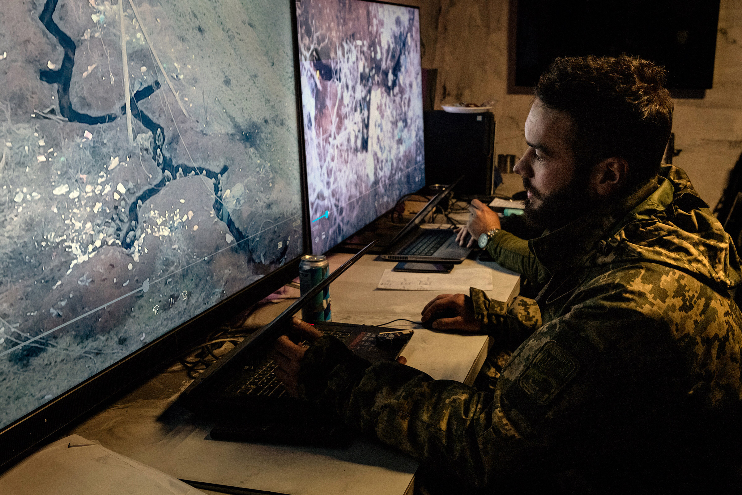 A Ukrainian analyst views drone footage of Russian trenches near Bakhmut, Ukraine, on Jan. 6, 2023.