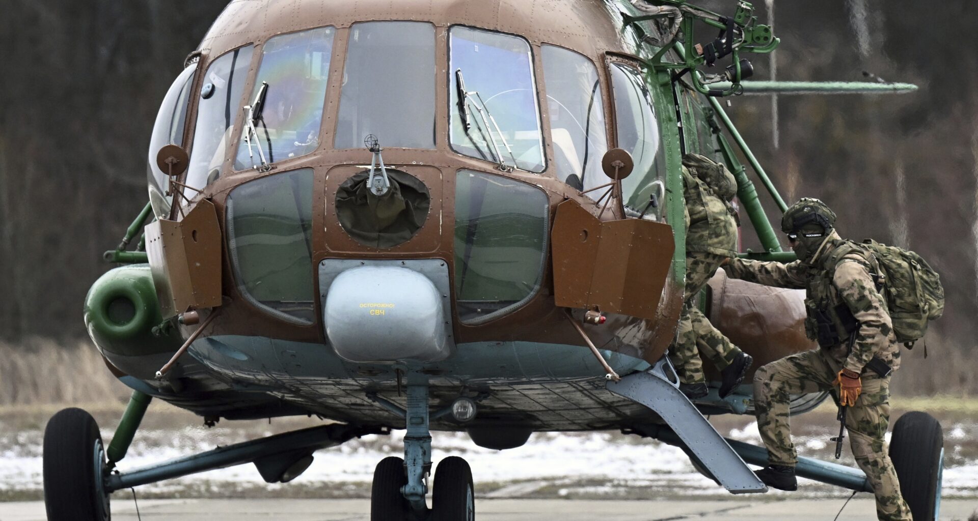 Russian Soldiers Boarding a Mi-8 Helicopter