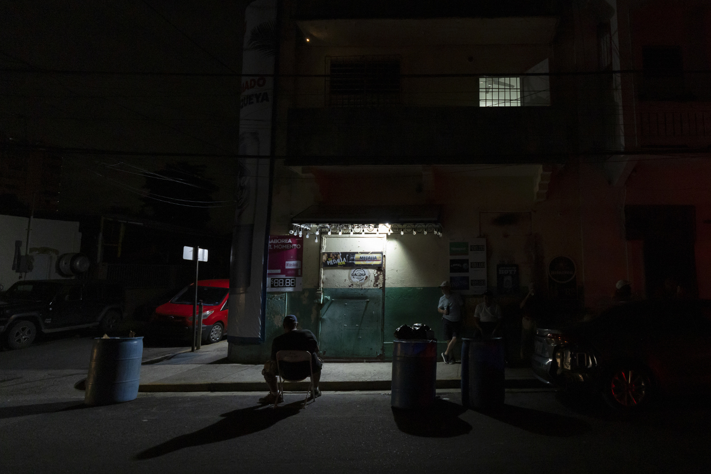 A generator powered lamp on a sidewalk in Puerto Rico.