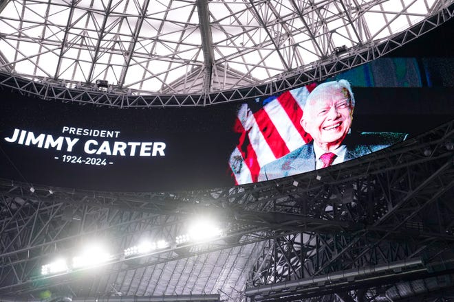 Jan 1, 2025; Atlanta, GA, USA; A general view of a memoriam for former President Jimmy Carter before the Peach Bowl at Mercedes-Benz Stadium. Mandatory Credit: Dale Zanine-Imagn Images