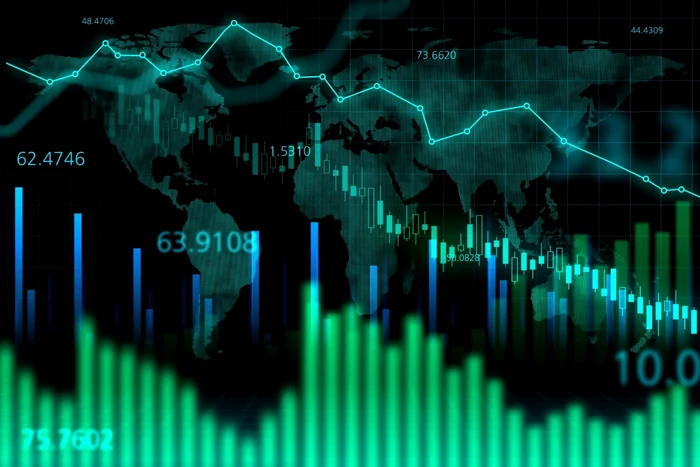 Grafice bursiere care indică o scădere abruptă, sugerând o criză economico-financiară