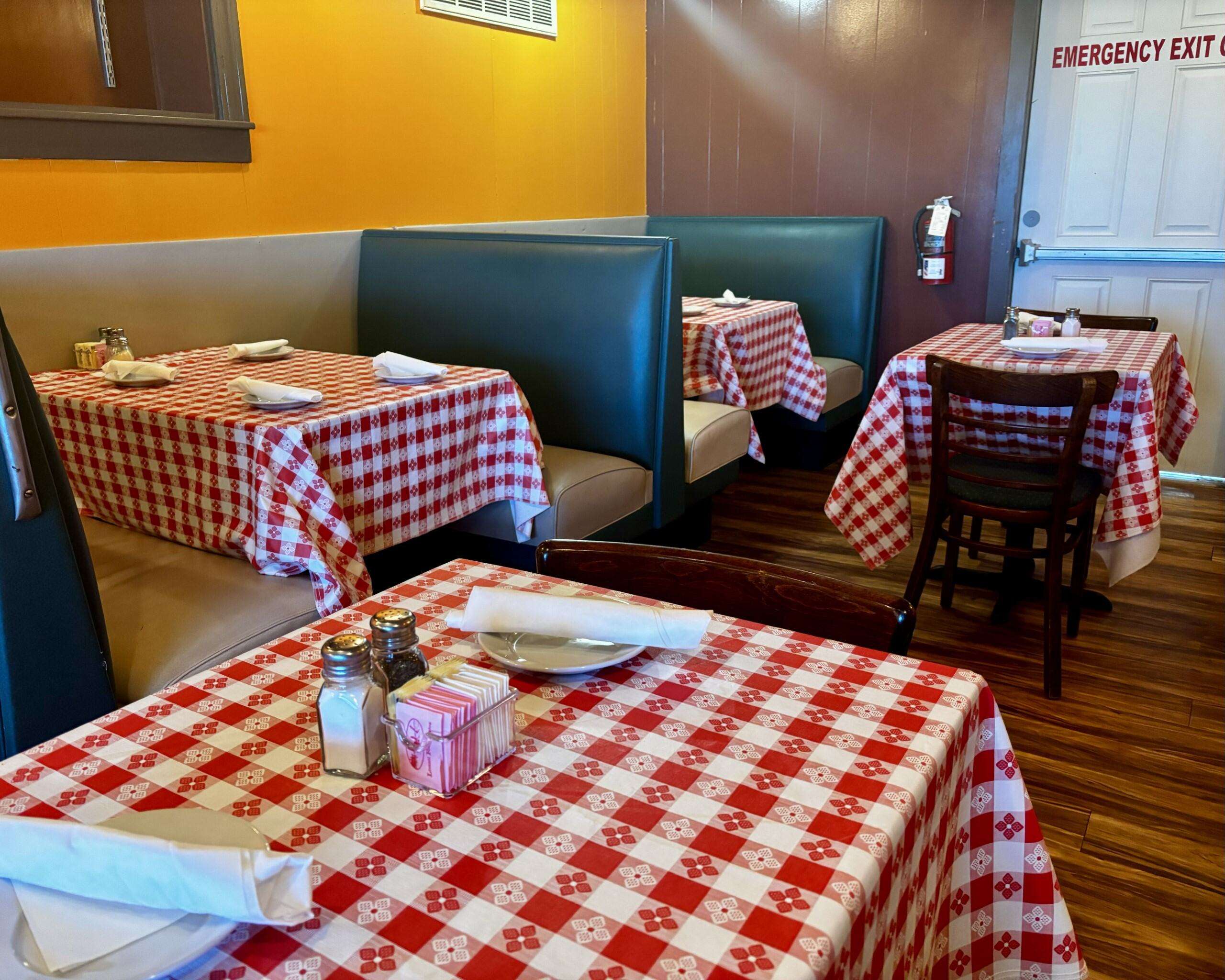 A dining area with booths and tables at the Italian Cafe in Hays. Photo By Tony Guerrero/Hays Post