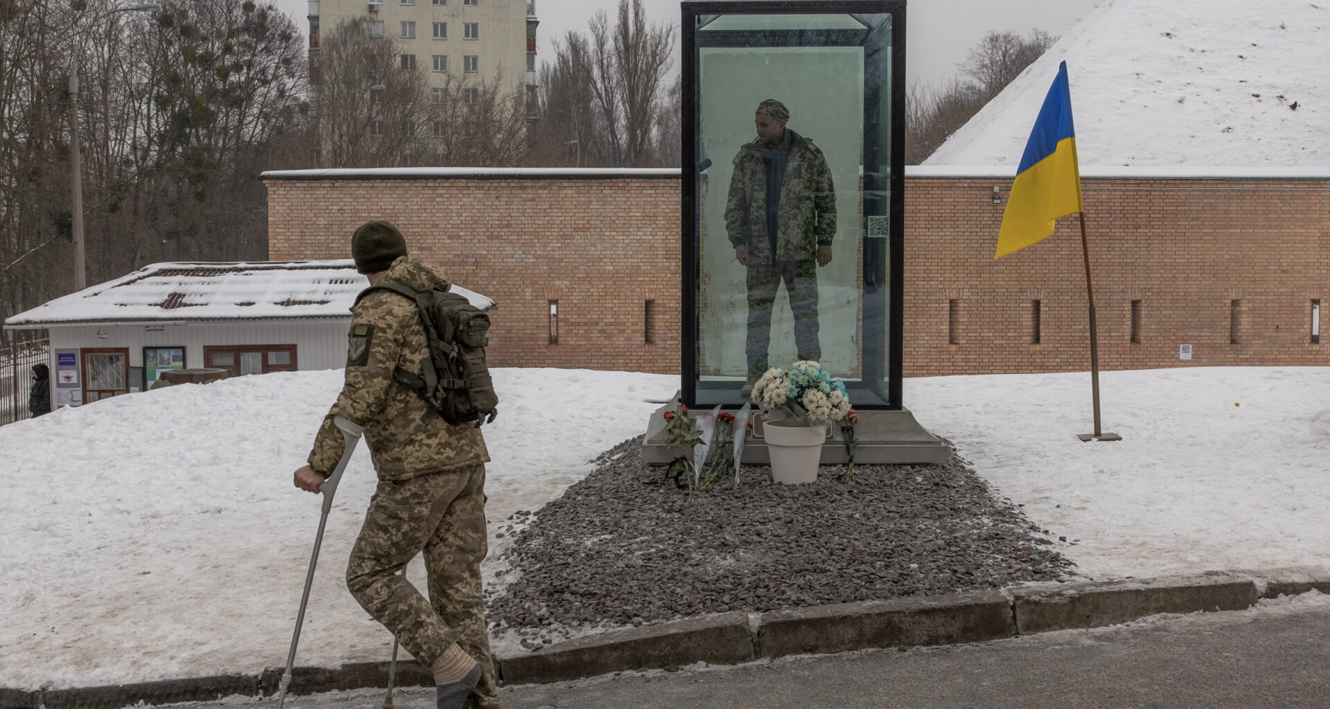 A Ukrainian military member on crutches