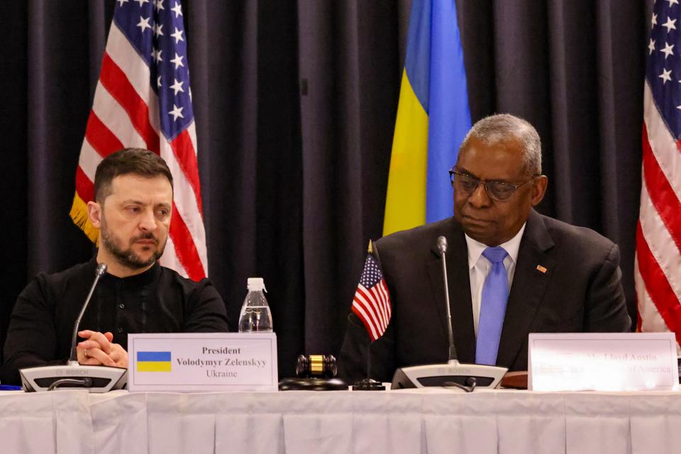 Volodymyr Zelensky and US secretary of defence Lloyd Austin react during the opening of the Ukraine Defense Contact Group meeting at Ramstein Air Base, Germany (Getty Images)