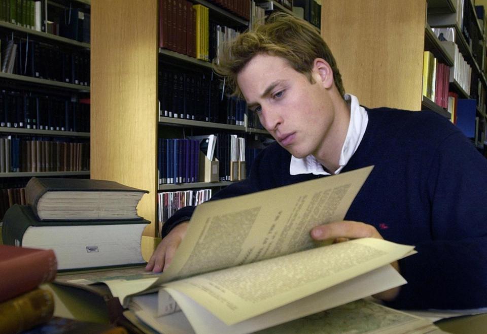 Prince William studying in a library.