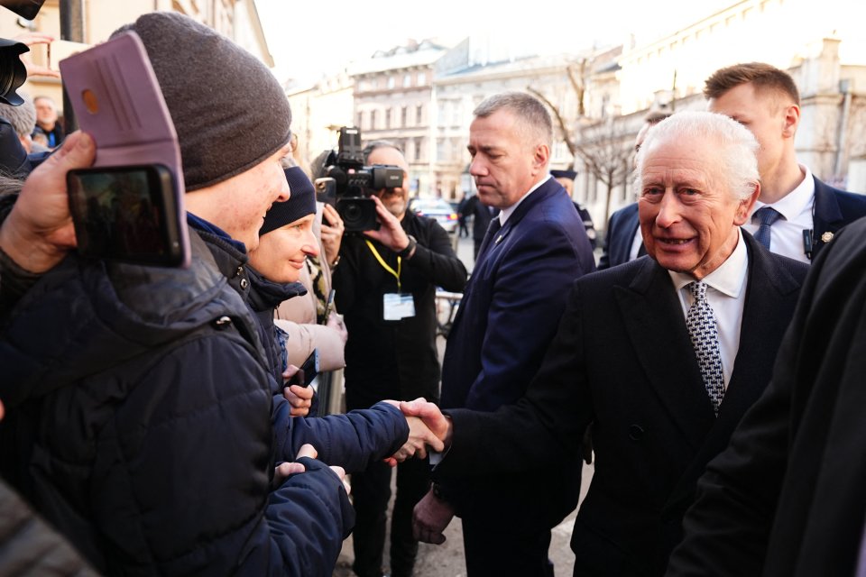 King Charles III shaking hands with well-wishers in Krakow, Poland.