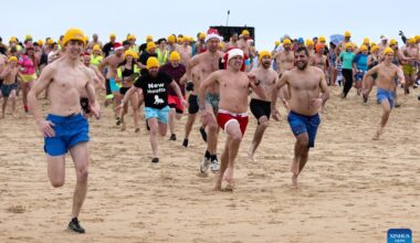 People participate in New Year's Dive 2025 in Ostend, Belgium-Xinhua