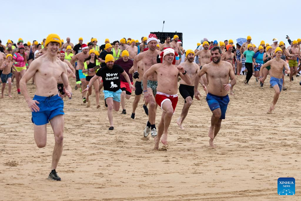 People participate in New Year's Dive 2025 in Ostend, Belgium-Xinhua