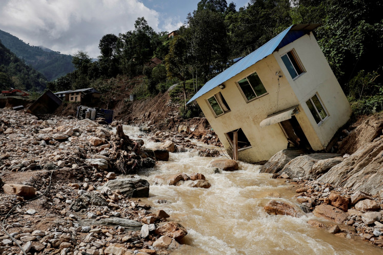 A view of damaged houses after the deadly floods following heavy rainfall along the bank of Kalati River in Bhumidanda village of Panauti municipality in Kavre, Nepal on Oct. 1, 2024.
