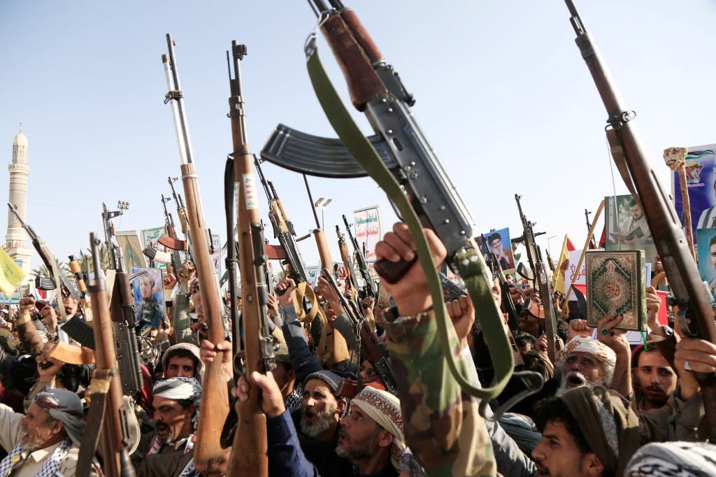 Yemen’s Houthi followers brandish weapons and chant slogans as they take part in a protest against the Israeli air strikes on Yemen on December 27, 2024, in Sana’a, Yemen. Getty Images
