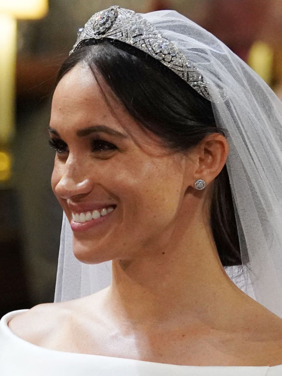 Meghan Markle arrives at the High Altar for her wedding ceremony with an effortless low bun