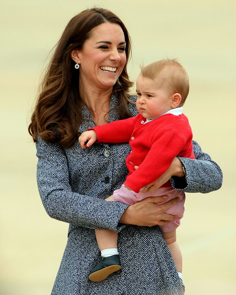 Kate Middleton with her son Prince George at the Defence Establishment Fairbairn in Canberra on April 25, 2014. 