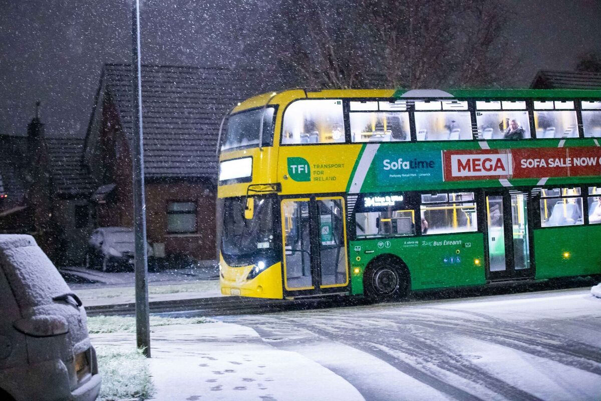 A bus travels through snowy conditions in Limerick as icy roads disrupt public transport schedules. Picture: Damien Storan