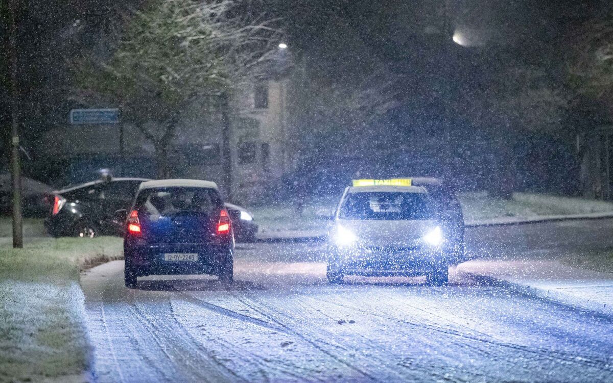 Cars navigate snowy and icy roads in Limerick as a severe cold snap creates hazardous driving conditions. Picture: Damien Storan.