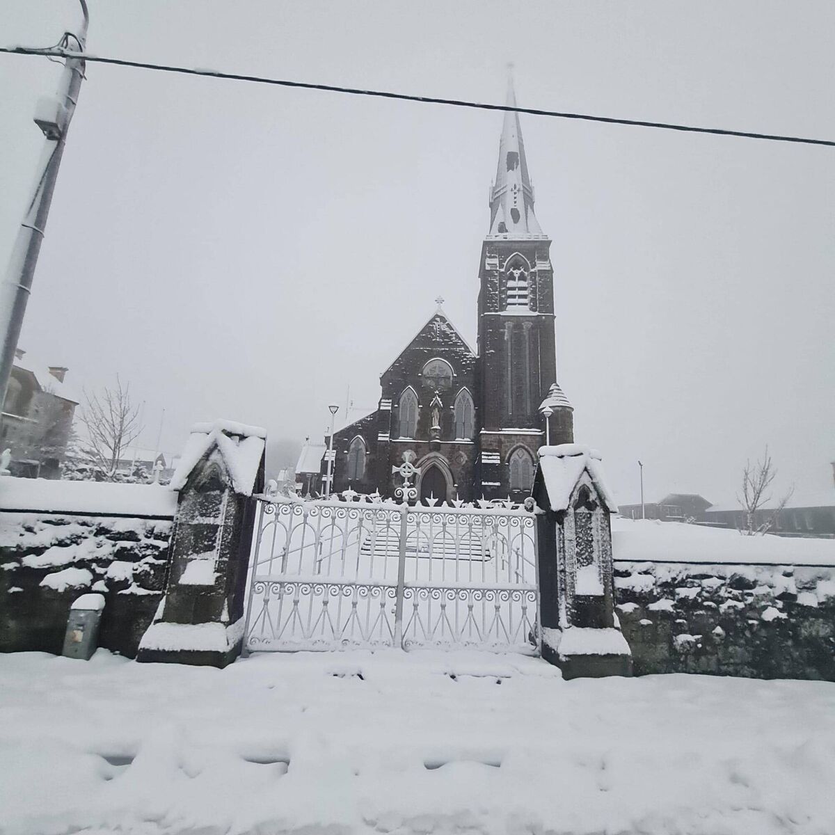 Snow on the grounds of the church in Kilfinane, Co Limerick on Sunday. Picture: Anthony Palmer