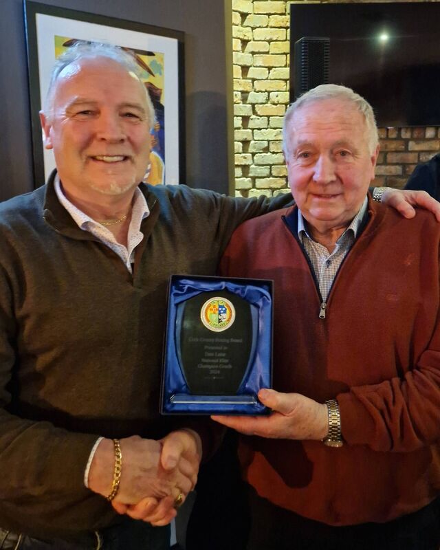 Conal Thomas makes a presentation to Dan Lane, Rylane BC at Hickeys Bar, Dromahane  JW 