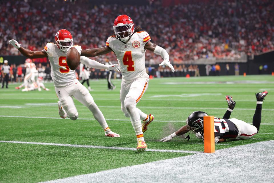 ATLANTA, GEORGIA - SEPTEMBER 22: Rashee Rice #4 of the Kansas City Chiefs scores a touchdown while defended by Dee Alford #20 of the Atlanta Falcons during the second quarter at Mercedes-Benz Stadium on September 22, 2024 in Atlanta, Georgia. (Photo by Kevin C. Cox/Getty Images)