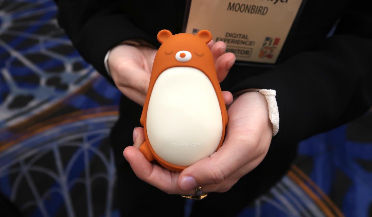 The Moonbuddy guided breathwork device shown wearing the Bear sleeve