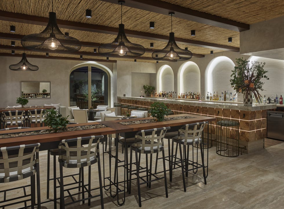 Modern bar and seating area with stylish decor.